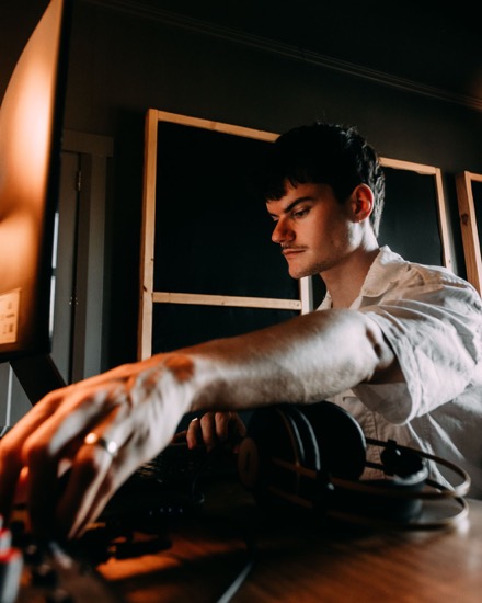 Justin, aka Jpec, at his mastering desk